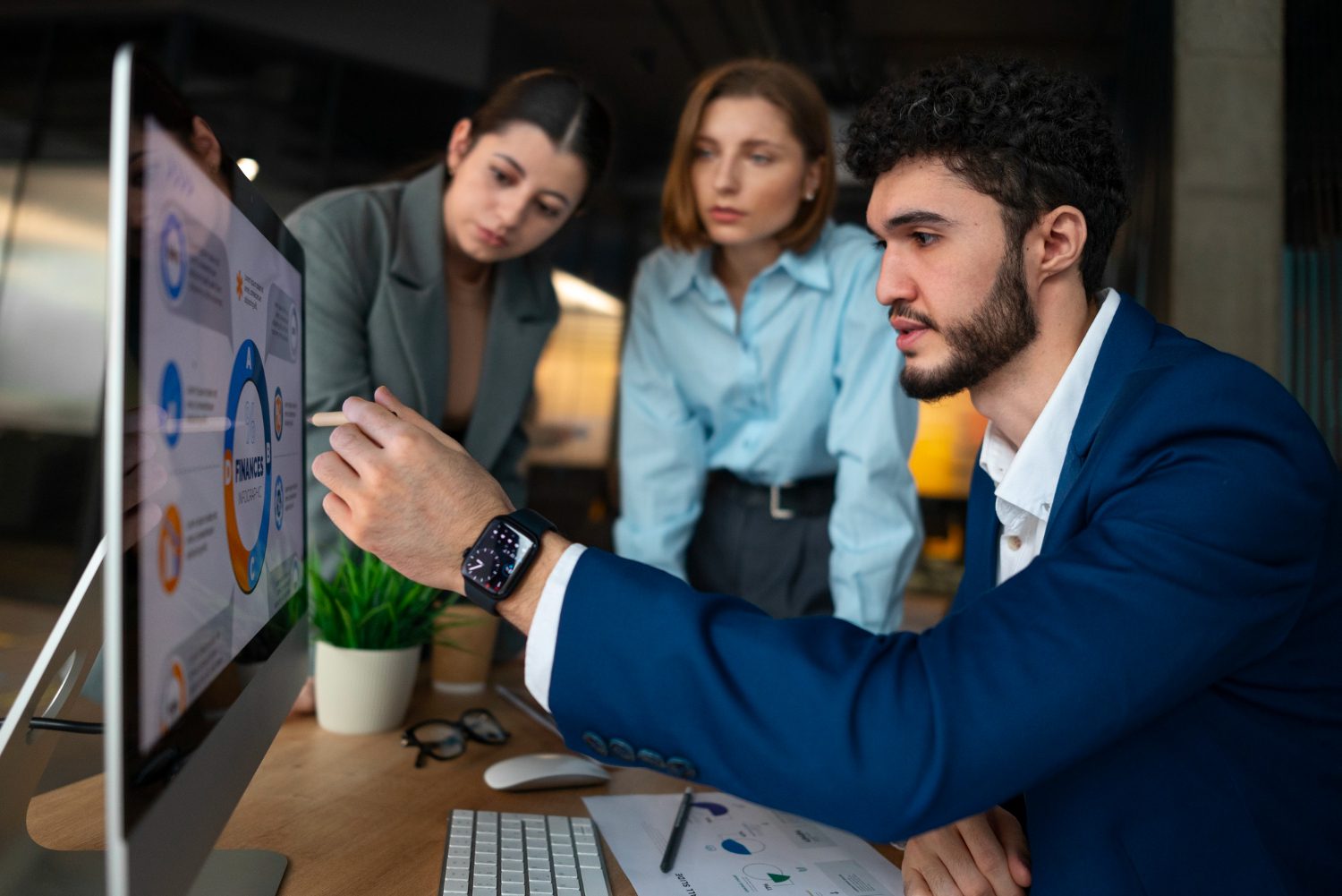 People in the office analyzing and checking finance graphs<br />
