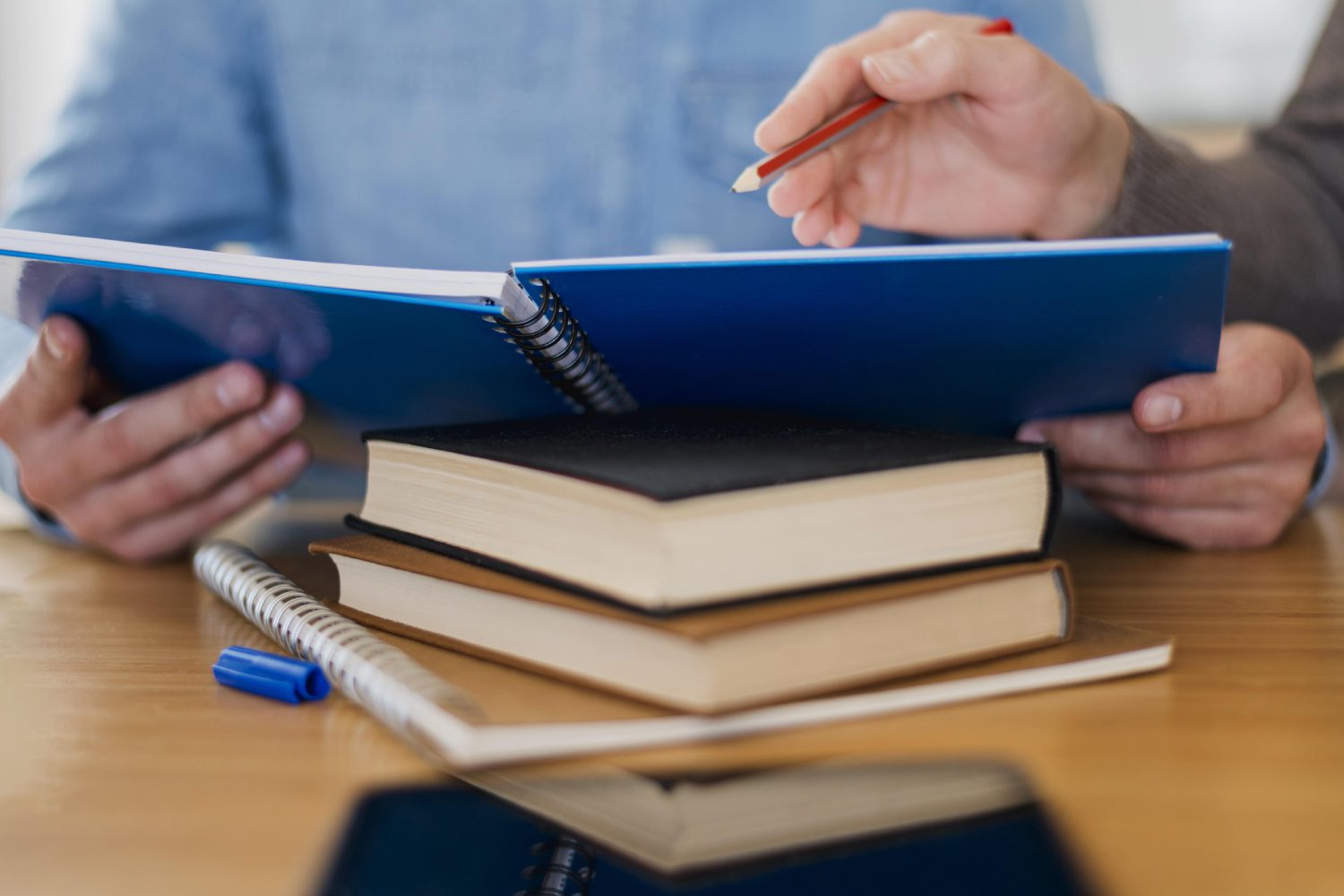 high-angle-man-holding-notebook